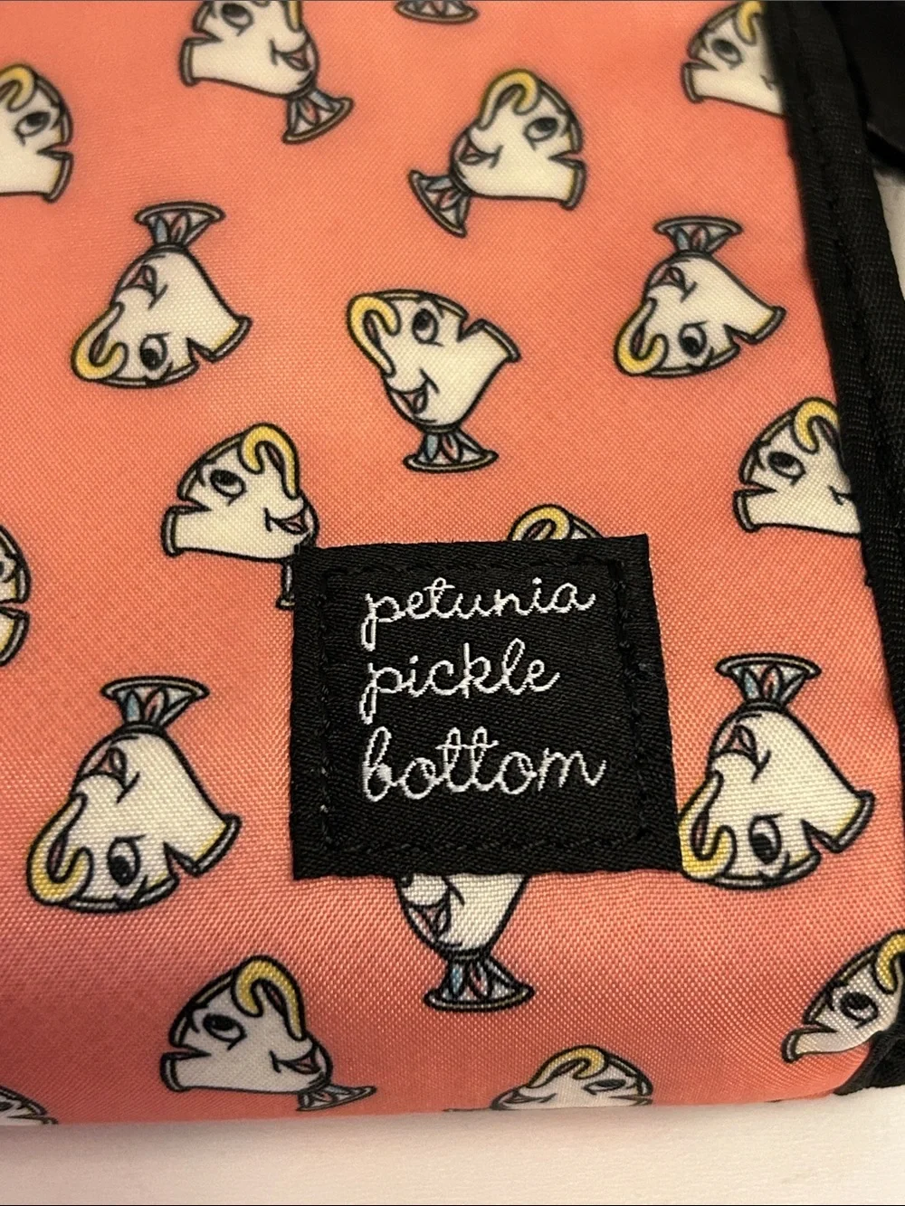 Petunia Pickle Bottom Coral Pouch with White Dog Print and Black Trim